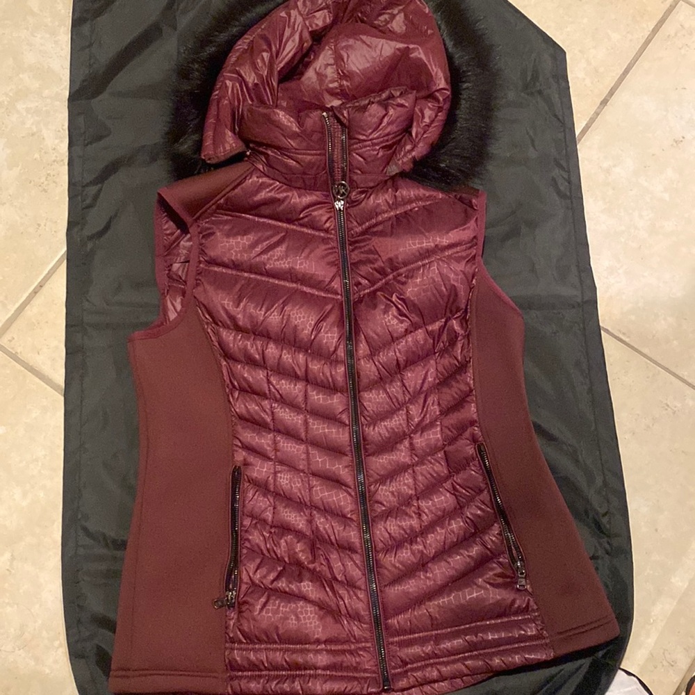 Michael Kors Vest size large , side of stretch material , with fur hood